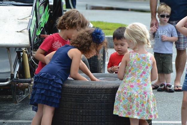 kids checking out a tire